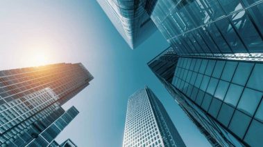 Skycrapers in finance district 2 Resilient Real Estate Stocks to Buy in a Turbulent Market