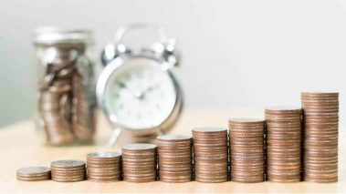 STACKED COINS DEPICTING MONEY GROWTH Fight Inflation Fears With This Valuable Dividend Stock