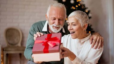 Elderly man giving a Christmas present to his wife1 3 Canadian Dividend Stocks I’d Buy This Christmas