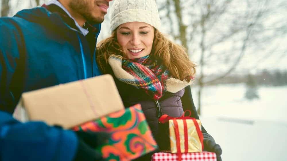 Smiling couple holding Christmas presents1 Christmas Sale: Grab 2 Cheap Dividend Stocks for Yields up to 6%!