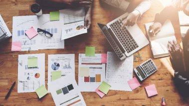 stock researching 2 Cheap TSX Dividend Stocks to Buy in the Market Correction